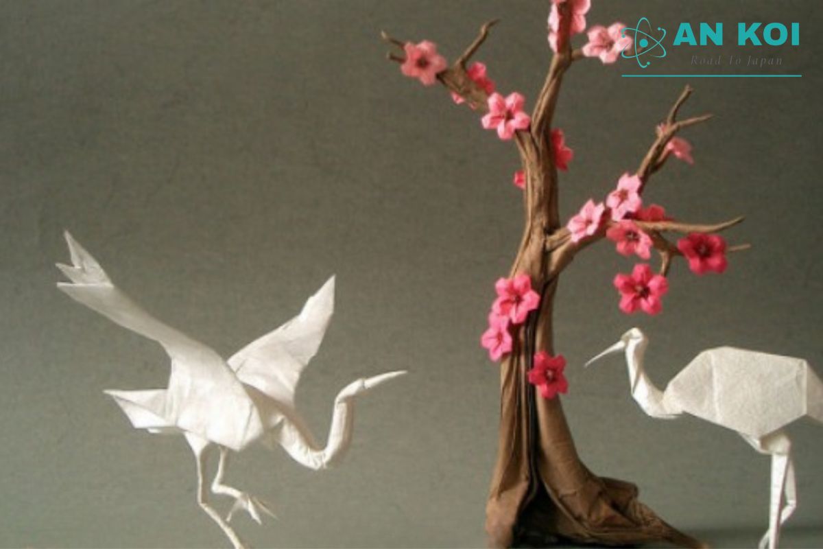 This paper crane illustrates the principle of shaping with folds while minimizing cutting and gluing in traditional Origami.